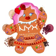 Shows the NYX Professional Makeup Holiday Gingerbaddie Palette closed, surrounded by scattered loose eyeshadow pigments that are shade from the palette.