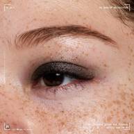 Close-up of an eye wearing NYX Professional Makeup Party Animals Lid Lingerie Cream Eye Pigment in Gothic Garter, a deep metallic black shade.