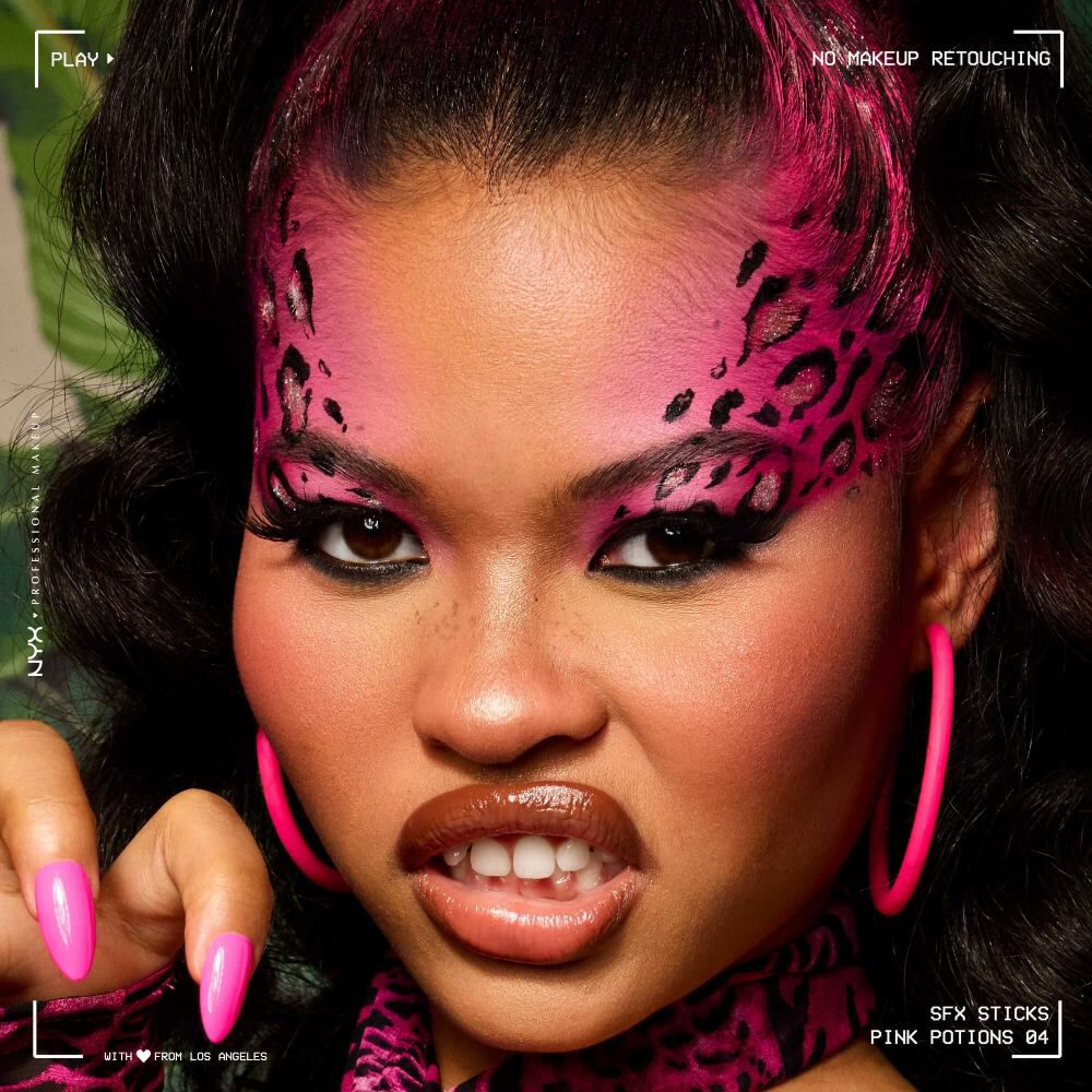 Model wearing vivid pink and black leopard-inspired face paint created with NYX Professional Makeup Party Animals SFX Face & Body Paint Sticks.